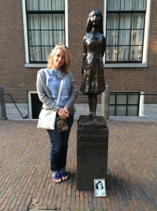 Debbie Spanberger by statue of Anne Frank, by Mari Andriessen, outside the Westerkerk in Amsterdam